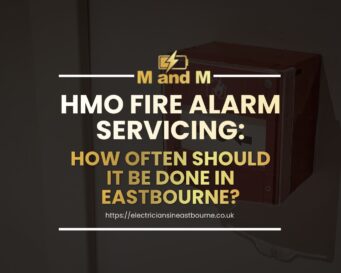 HMO fire alarm servicing in Eastbourne by NICEIC registered electricians inspecting fire alarm system